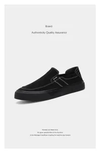 Minimalist black canvas slip-on loafers featuring white contrast stitching and thick soles