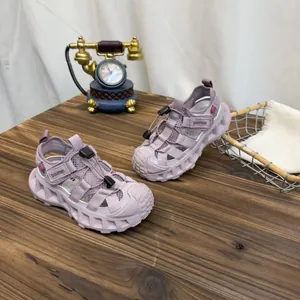 Close-up of lavender kids mesh sandals with breathable hollow design and chunky soles