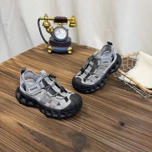 Detail of breathable grey children's sandals with mesh upper and durable rubber toe