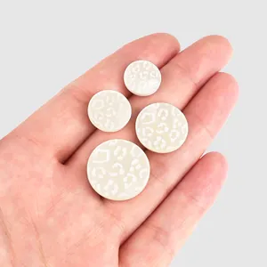 Boutons en nacre blanche haut de gamme avec motif léopard pour vêtements de luxe