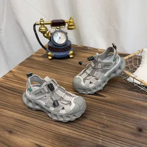 Detailed macro view of breathable grey mesh children's sports sandals with soft soles