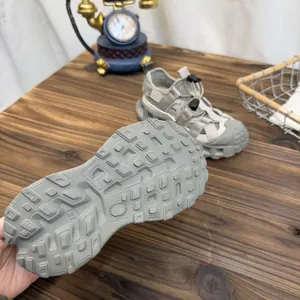 Detailed view of the anti-slip sole on grey breathable mesh children's sports sandals