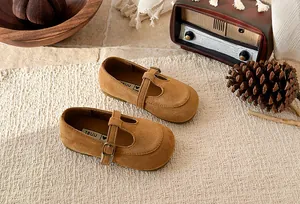 Detailed view of brown suede T-strap Mary Jane shoes for girls with a vintage aesthetic.