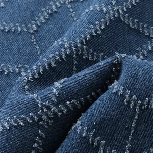 Gros plan détaillé du tissu denim bleu avec un motif de grille en diamant texturé