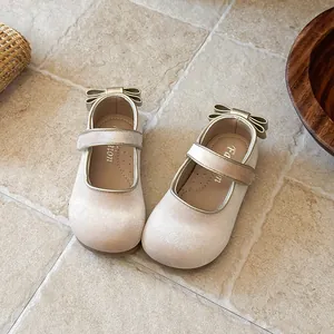 Elegant cream velvet girls' Mary Jane shoes with bow detail on heels
