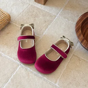 Elegant burgundy velvet girls Mary Jane shoes with gold bow detail and soft sole