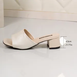 Detailed side view of cream chunky heel slide sandals with 4.5cm heel height measurement