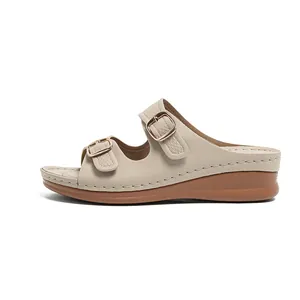 Beige leather wedge sandals for women with double buckle straps and comfort sole