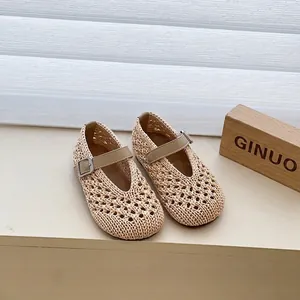 Detailed view of beige woven hollow-out breathable sandals for girls with buckle strap