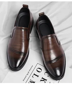 Detailed macro view showing the polished brown leather texture of men's business shoes.