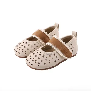 Breathable beige children's Mary Jane shoes with hollow-out patterns and soft soles