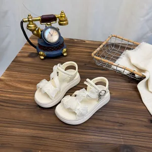 Princess style cream white girl's sandals with delicate lace bows and pearls