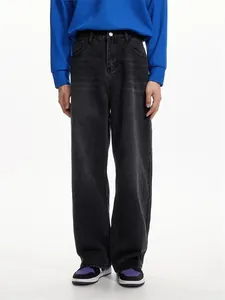 Detail view of men's loose straight leg washed vintage denim jeans in dark grey