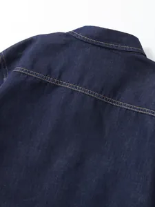 Back detail of men's navy blue long sleeve denim shirt with workwear stitching