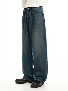 Detailed side view of men's loose straight-leg vintage washed blue denim jeans