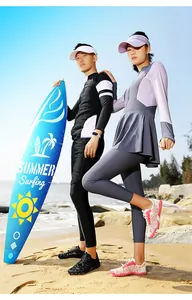 High-quality quick-dry water shoes for couples in a sunny beach surfing scene.