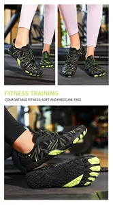 Detail shot of black and neon green outdoor wading shoes for fitness training.