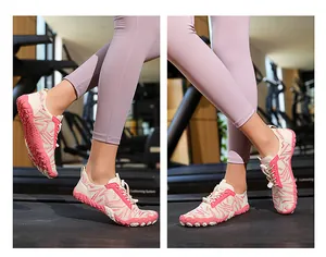 Lightweight pink and beige wading shoes shown on a treadmill for gym or outdoor use