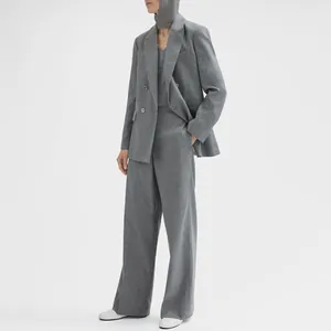 Premium black mother of pearl shell buttons featured on a stylish grey wool suit