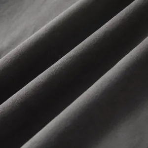 Close-up detail showing the charcoal gray twill fabric texture of a men's cotton shirt