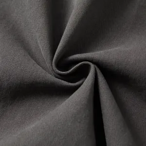Close-up of high-quality charcoal cotton denim fabric texture for men's shirt