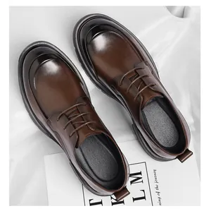 Top-down detail of polished brown leather business casual shoes with lace-up design