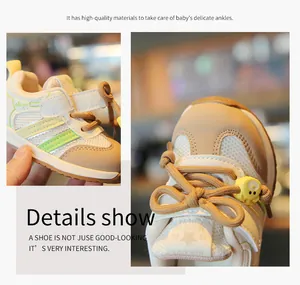 Close-up detail of breathable mesh and bear charm on baby sneakers