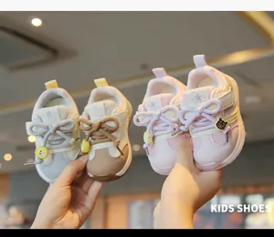 Detailed view of breathable pink and beige toddler mesh walking shoes with soft soles