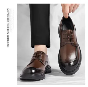 Detailed view of premium brown leather business dress shoes with stylish black gradient toe