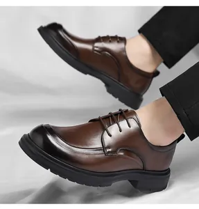 Detail view of stylish men's brown leather business dress shoes with lace-up design
