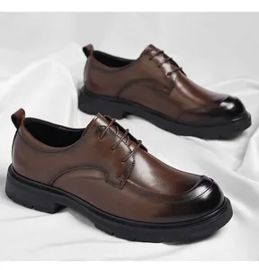 Detailed view of brown men's leather shoes with black toe caps and durable soles