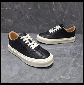 Macro view of premium black leather sneakers featuring thick white platform rubber soles