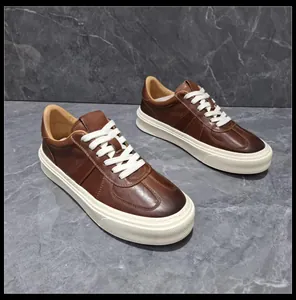 Retro brown leather sneakers with thick white soles and contrasting white laces