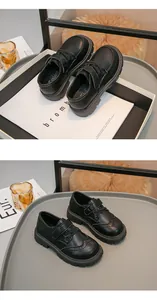 Dettaglio scarpe in pelle nera per bambini stile britannico con decorazioni brogue