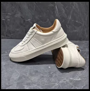 Detailed side view of premium white leather sneakers with thick rubber soles