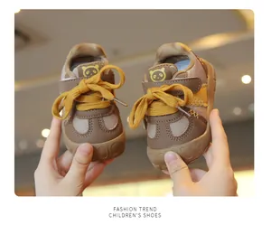Close-up of mesh breathable infant walker shoes with cute panda logo detail view