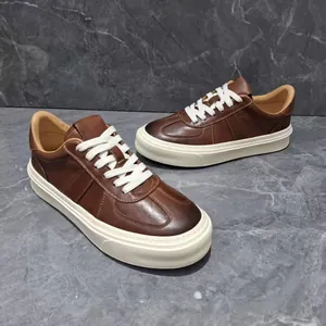 Premium brown leather sneakers with thick white soles and retro lace-up fashion design