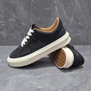 Premium black genuine leather men's sneakers with thick white soles and retro style.