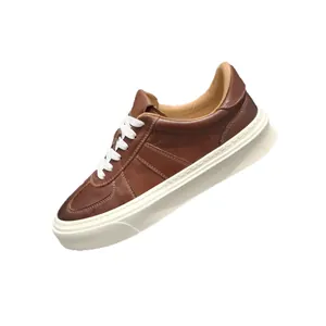 Vintage brown leather sneakers for men with thick white soles and classic lace-up design