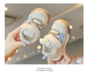Close-up of cream toddler walking shoes with breathable mesh and soft non-slip soles