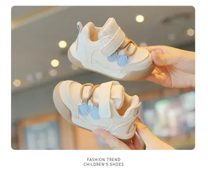 Close-up view of breathable baby mesh sneakers with bear accents and soft non-slip soles