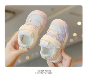 Close-up of lightweight purple and white mesh toddler sneakers with velcro straps.