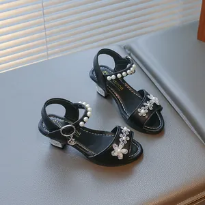 Elegant black girls' princess sandals with rhinestone flowers and pearl ankle straps