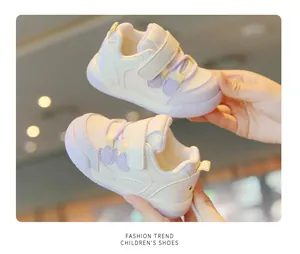 Detailed view of breathable mesh toddler walking shoes with soft soles and cute accents.