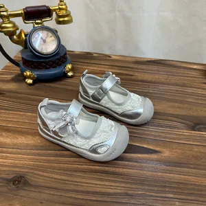 Detail of silver lace baby girl princess shoes with soft breathable mesh and flower bow
