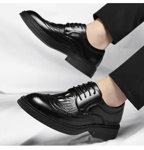 Detail of men's black crocodile embossed Brogue shoes with thick sole design