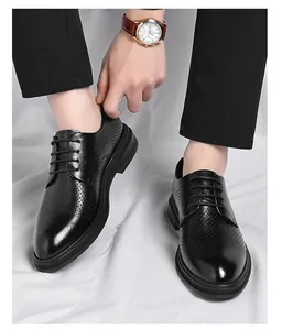 Detailed view of men's black hollow-out breathable leather business formal shoes