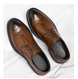 Top-down view showing detailed crocodile texture and wingtip design on brown brogue shoes