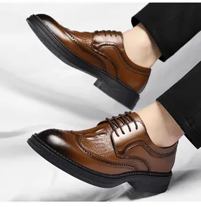 Close-up of men's brown Brogue shoes with crocodile pattern and wingtip details.