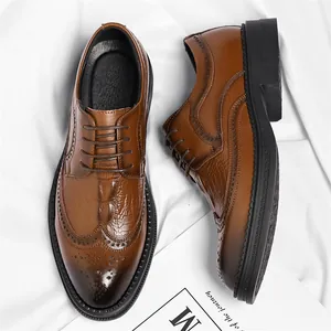 Classic brown men's business formal shoes with crocodile texture and brogue detailing
